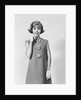 Smiling stylish young woman wearing sack dress gloves by Anonymous