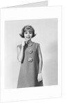 Smiling stylish young woman wearing sack dress gloves by Anonymous