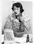 Woman face covered flour mixing ingredients reading brides cook book by Anonymous