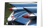 Detail fins rear tail lights blue cadillac auomobile by Anonymous