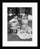 Man woman couple having a summer picnic outdoors drinking beer by Anonymous