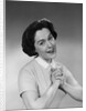 Brunette woman smiling happy satisfied proudly clasping hands to chest by Anonymous