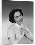 Brunette woman smiling happy satisfied proudly clasping hands to chest by Anonymous
