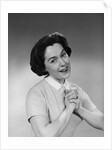 Brunette woman smiling happy satisfied proudly clasping hands to chest by Anonymous