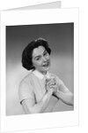 Brunette woman smiling happy satisfied proudly clasping hands to chest by Anonymous