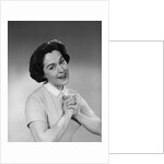 Brunette woman smiling happy satisfied proudly clasping hands to chest by Anonymous
