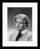 Blonde woman fist to chin worried serious facial expression by Anonymous