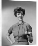 Brunette woman knit dress offhand gesture serious expression by Anonymous