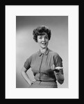 Brunette woman knit dress offhand gesture serious expression by Anonymous