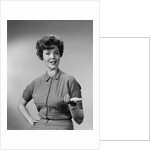 Brunette woman knit dress offhand gesture serious expression by Anonymous