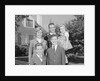 Family portrait father mother two sons and daughter in front of suburban house by Anonymous