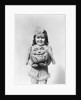 Happy smiling little girl in costume holding a papier-mache pumpkin head by Anonymous