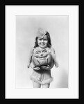 Happy smiling little girl in costume holding a papier-mache pumpkin head by Anonymous