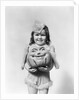 Happy smiling little girl in costume holding a papier-mache pumpkin head by Anonymous