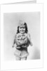 Happy smiling little girl in costume holding a papier-mache pumpkin head by Anonymous