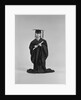 Girl wearing graduation cap gown holding diploma by Anonymous
