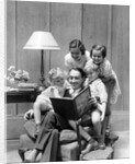 Father reading to family in chair by Anonymous
