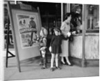 Mother and 2 children buying tickets to movie matinee boy wearing cowboy costume by Anonymous