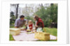 Family mother father girl spring picnic on checkered tablecloth by Anonymous