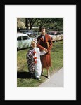 Mother with son dressed in clown suit outdoors by Anonymous