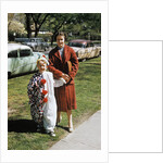 Mother with son dressed in clown suit outdoors by Anonymous