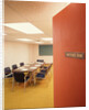 Conference room interior with table chairs chalkboard open door ajar by Anonymous