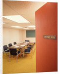 Conference room interior with table chairs chalkboard open door ajar by Anonymous
