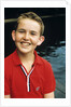 Portrait young boy in red shirt smiling by Anonymous