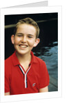 Portrait young boy in red shirt smiling by Anonymous