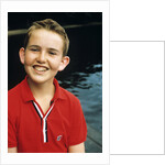 Portrait young boy in red shirt smiling by Anonymous