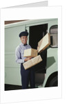 Delivery truck driver holding packages by Anonymous