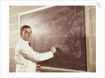 Science professor writing a formula for chelating agent on chalkboard by Anonymous