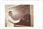 Science professor writing a formula for chelating agent on chalkboard by Anonymous