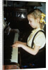 Little blond girl playing practicing the piano by Anonymous
