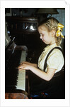 Little blond girl playing practicing the piano by Anonymous