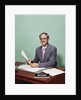 Smiling man at desk holding papers with mortgage officer sign looking at camera by Anonymous