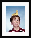 Boy with baby duckling sitting on top of his head by Anonymous