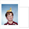 Boy with baby duckling sitting on top of his head by Anonymous