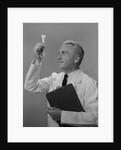 Man scientist studying test tube by Anonymous