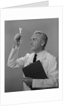 Man scientist studying test tube by Anonymous
