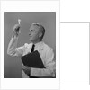Man scientist studying test tube by Anonymous