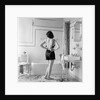 Back view of woman in bathroom fastening black bra by Anonymous
