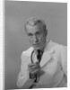 Male doctor holding stethoscope by Anonymous