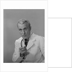 Male doctor holding stethoscope by Anonymous