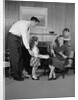 Family living room woman mother getting surprise gift from children daughter son husband by Anonymous
