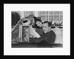 Husband wife man woman in automobile reading map by Anonymous