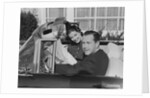 Husband wife man woman in automobile reading map by Anonymous
