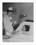 Woman nurse checking pulse taking temperature on little girl patient in hospital bed by Anonymous