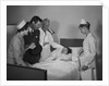 Man doctor woman nurse mother father seeing visiting smiling little girl patient in hospital bed by Anonymous