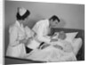 Doctor and nurse checking on elderly male patient in hospital bed by Anonymous